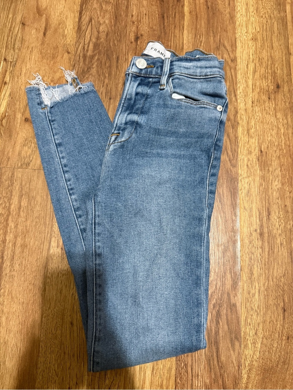Frame Denim Medium Wash High-Rise Skinny Jeans with Frayed Hem